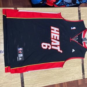 Basketball jersey. New.  Never worn. Black and red. Size medium in men